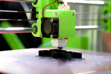 A desktop 3d printer in the laboratory for prints a structure from a polymer