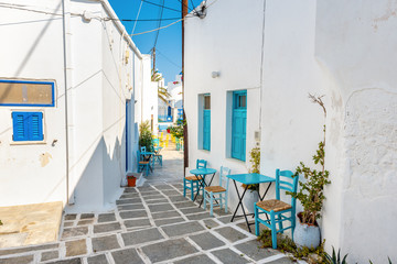 Paved alley with tables and chairs in Chora. Serifos island, Greece © vivoo
