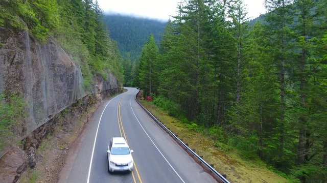 Over the higway with steep cliffs and fencing for falling rocks