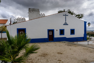 Typical whitewashed terraced cottages in the picturesque historic village of Coruche. Santarem, Ribatejo, Portugal. © solipa