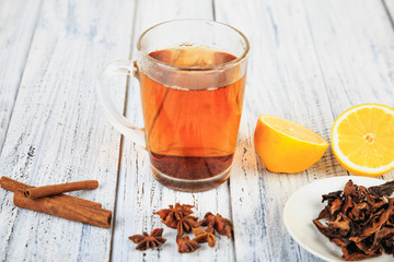 hot tea, cinnamon sticks, star anise and orange