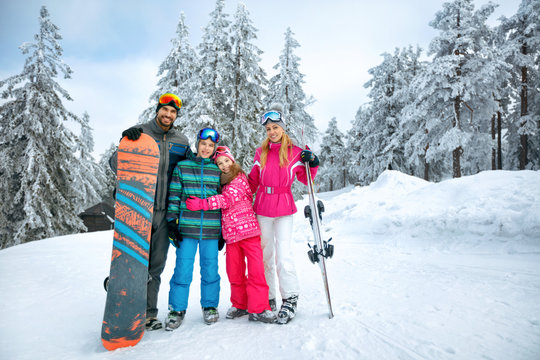 Happy family enjoying in winter vacations