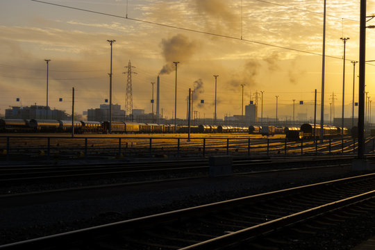 Sunrise glow, railways tracks and carriages at the cargo terminal of Basel, Switzerland.