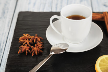 hot tea on black slate square stone