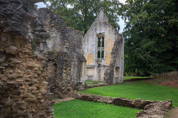 Ruins of old church walls and foundation in the English countryside