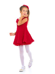 Little girl blowing on the palm