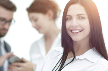 Fototapeta premium close-up of a beautiful woman manager and co-workers in the office