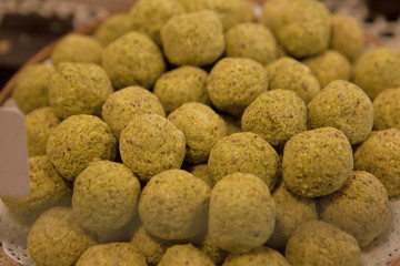 Asorted chocolate truffles and pralines. Chocolate and coconut candies on the counter in the confectionery store