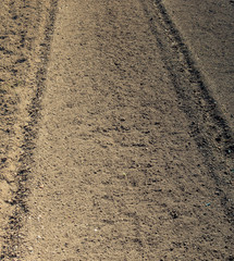 Plowed field with  traces in view