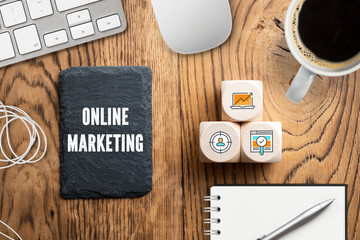 Online Marketing on Slate Background and computer workspace