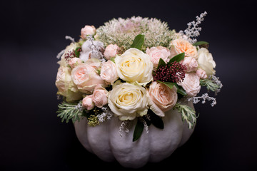 flower bouquet in a white pumpkin on a black background, a mixture of flowers, peony rose, eucalyptus, chrysanthemum, Brassica, white orchid, cotton