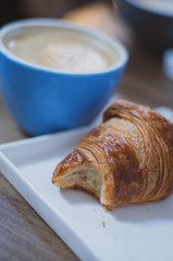 breakfast: cappuccino with croissant 