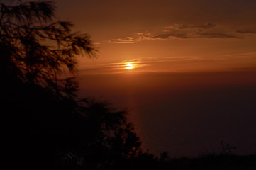 Evening strolls on the hill sun orange and sea view