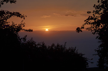 Evening strolls on the hill sun orange and sea view