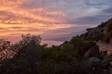 Evening strolls on the hill sun orange and sea view