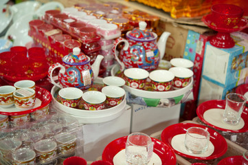 Chinese tea pot and cups on street market in Thailand, blur focus