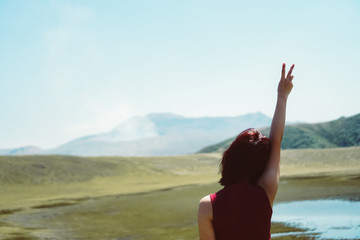 Man rise hands up to sky freedom concept with blue sky and summer beach background.