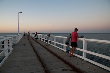 Busselton Australia, the jetty is a meeting point for locals who fish and swim in the evening