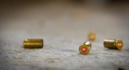 9 mm bullet shells. It's lying on the ground