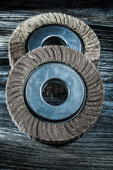 Used grinding wheels on vintage wooden board