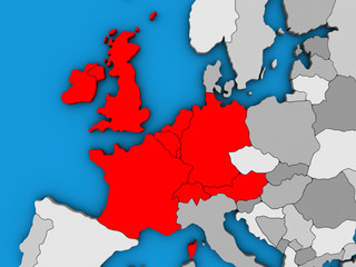 Western Europe on blue political 3D globe.