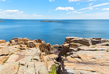 Acadia National Park landscape, Maine, USA. A split in geological formation of granite rocks and sea view up to horizon.