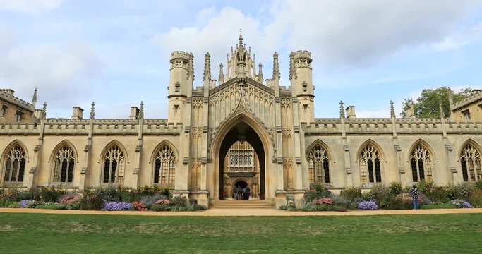 Cambridge University SJ College building England 4K. University of Cambridge, founded in 1209 one of top five universities in world. City occupied 3,500 years. Industry of education.