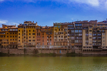 Fototapeta na wymiar Houses by Arno River in Florence, Italy