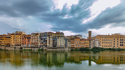 Fototapeta na wymiar Houses over the Arno river in Florence, Italy