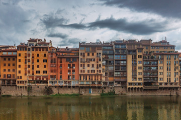 Fototapeta na wymiar Houses over the Arno river in Florence, Italy