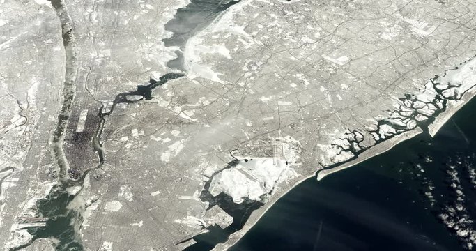 Very high-altitude circular tracking shot of a frozen New York City. Reversible, seamless loop. Elements of this image furnished by NASA