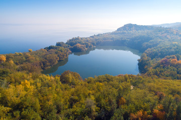 Fototapeta na wymiar Picturesque mountain lake in autumn. Lake near the sea. Beautiful wild nature. Aerial view