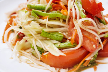 Thai food, green papaya salad or Somtum in Thai, Close up.