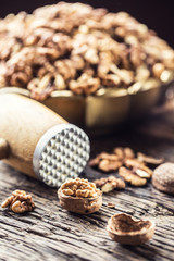 Walnut kernels whole walnuts in burlap sack and vintage bowl