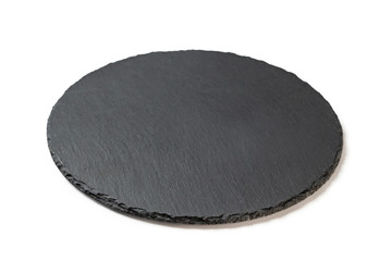 Round stone black plate for food serving isolated at white background.
