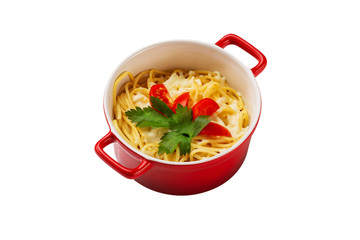 Pasta with fresh green and tomato in a red ceramic bowl isolated at white background.