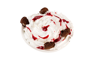 Bowl of sweet ice cream decorated with chocolate cookies and syrup isolated at white background.