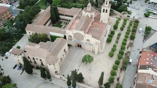 View from drone of ancient Benedictine abbey in Sant Cugat del Valles, Catalonia, Spain