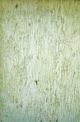 Abstract textured background: mixture of blue and green putty. Uneven strokes, rough texture of a wall pattern