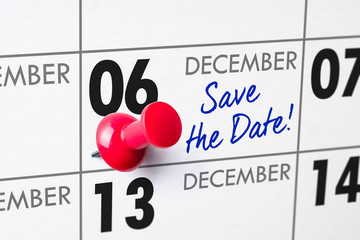 Wall calendar with a red pin - December 06