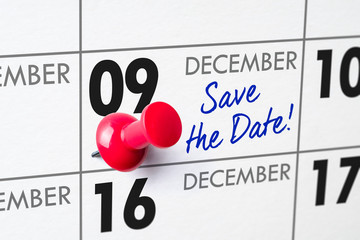 Wall calendar with a red pin - December 09
