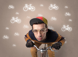 Young ridiculous biker with line drawn bikes on the background