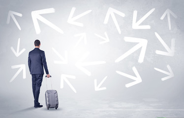 Businessman with back walking away with higgledy-piggledy arrows around
