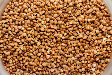 Grain of buckwheat close-up, buckwheat texture_