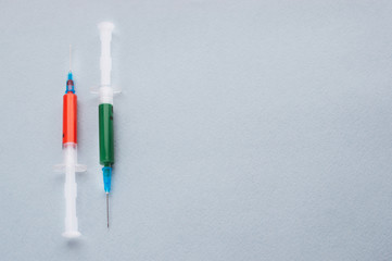 Two syringes on a light background. Concept drugs.