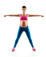 Pregnant woman doing yoga exercise on last months of pregnancy isolated on white background. Concept of healthy life