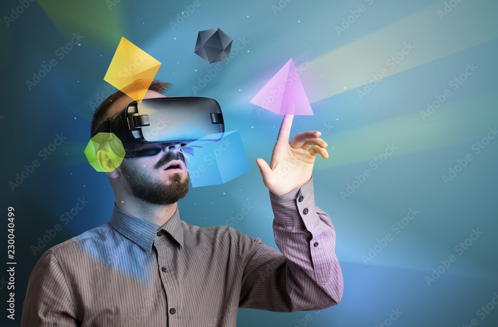 Poster amazed businessman with virtual reality colorful geometric shapes in front of him