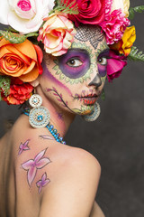 Girl wearing makeup for the dia de los muertos. The day of the dead.