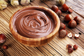 Homemade hazelnut spread in wooden bowl. Hazelnut Nougat cream