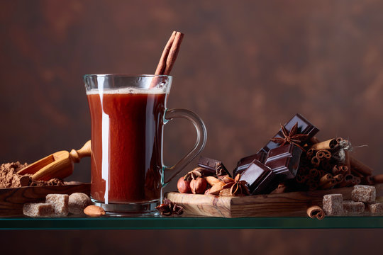 Hot chocolate with cinnamon, chocolate pieces and various spices.